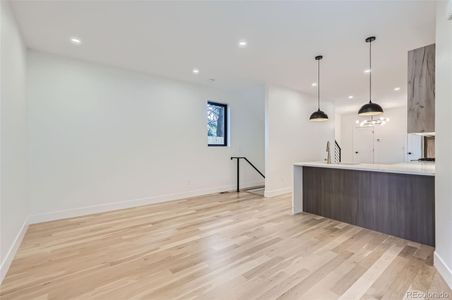 Front door opens to living space & kitchen