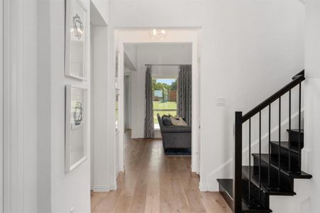 Foyer entrance with light hardwood / wood-style flooring