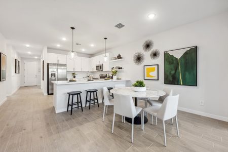 Cozy dining area and great room with wood-look tile