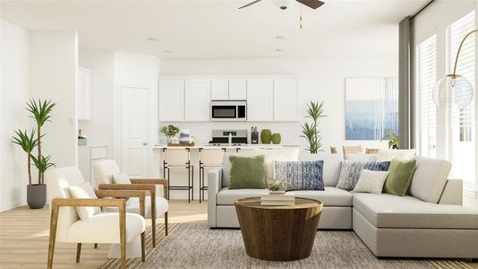 Living room featuring light hardwood / wood-style floors and ceiling fan