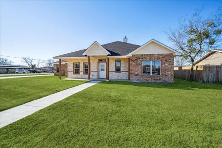 Single story home with a porch and a front yard