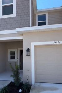 New construction Townhouse house 34226 Polacca Lane, Wesley Chapel, FL 33543 - photo 0