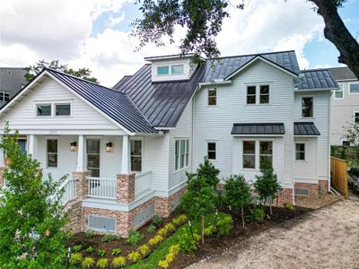 Schedule an appointment today to see this incredible home! Charming two-story with sleek metal roof, cozy porch, and lush landscaping in a serene neighborhood.