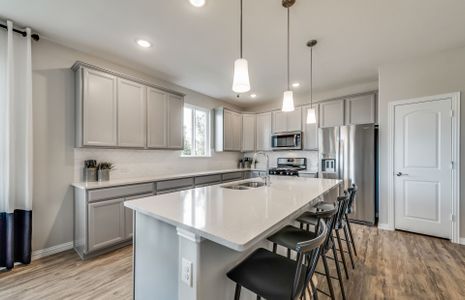 Spacious island kitchen with eat-in bartop