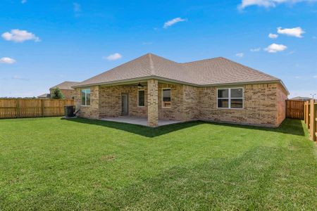 The spacious covered patio is perfect for outdoor entertaining. Photo is for example purpose. Brick color may be different than example photo.