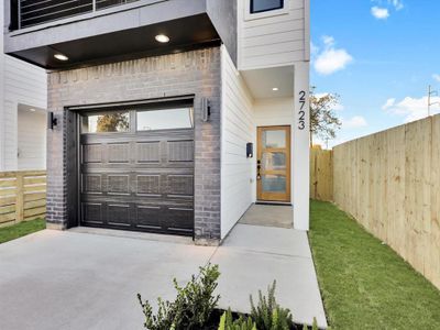 Doorway to property featuring a garage