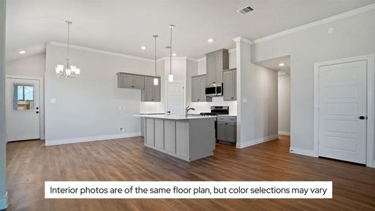 The kitchen island has beautiful and durable quartz countertops and a farmhouse sink.