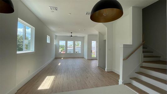 Open-concept living and dining space with ample natural light.