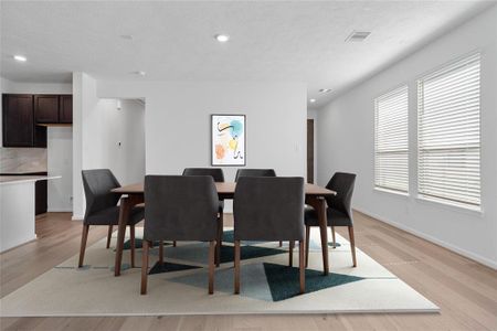 Make memories gathered around the table with your family and friends! The dining area features high ceilings, large windows with privacy blinds, and easy access to your kitchen and family room.