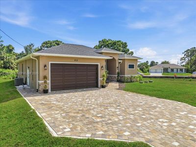 New construction Single-Family house 810 Sentinela Blvd, Lehigh Acres, FL 33974 - image
