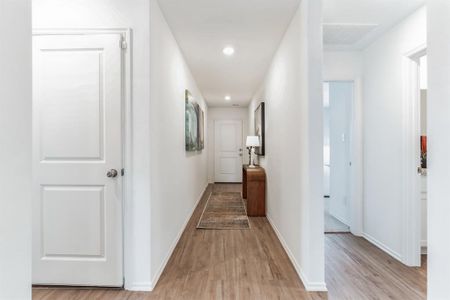 Hall with light hardwood / wood-style flooring