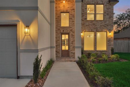 New landscaping and a two story porch welcome you to this home.