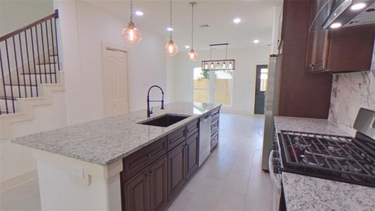 4209 Tampico St.This gorgeous kitchen showcases an impressive 10-foot Brazilian granite countertop ready to entertain all you friends and family.