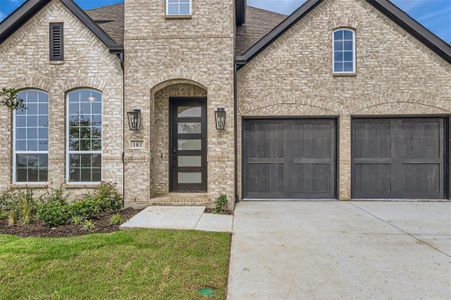 Doorway to property featuring a garage