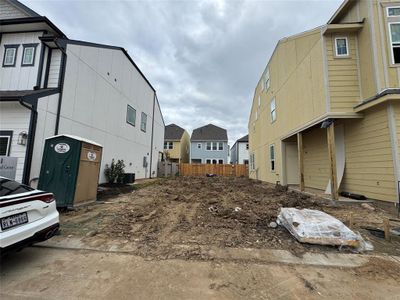 Three-story home with 3 bedrooms, 3.5 baths, and 2 car garage.