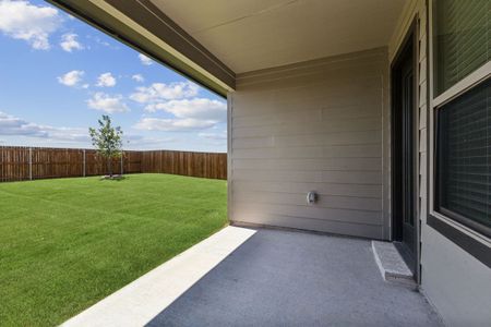 Covered Patio in the Amber home plan by Trophy Signature Homes – REPRESENTATIVE PHOTO