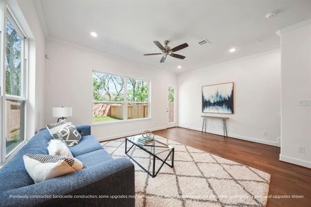 Living Room with Natural Light – Tall ceilings, recessed lighting, and oversized windows make this living space bright, airy, and perfect for relaxation.