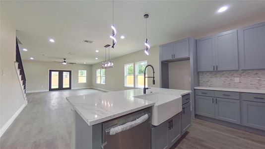 7920 James Franklin St kitchen opened to the living room.