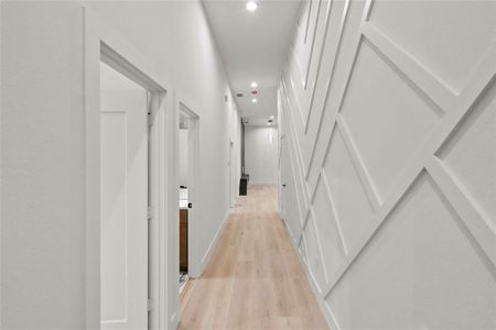 Corridor with light wood-type flooring