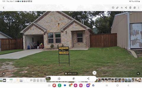 View of front of property with a front yard