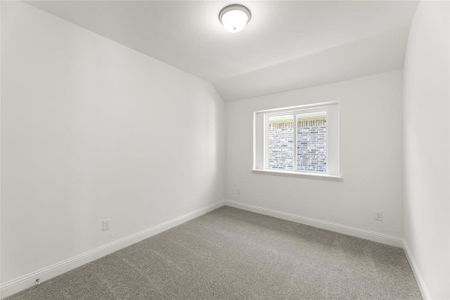 Spare room with ceiling fan, a healthy amount of sunlight, and light wood-type flooring