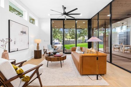 Open living space surrounded by floor to ceiling windows