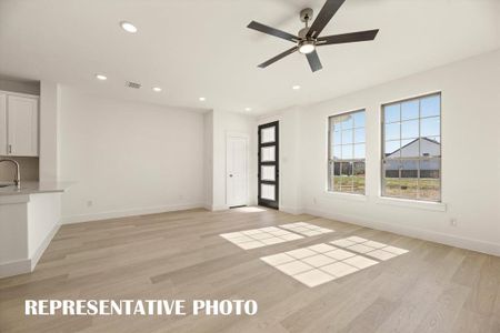 This spacious, light filled family room is the perfect place to host friends and family!  REPRESENTATIVE PHOTO