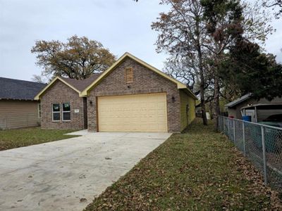 View of property exterior featuring a garage