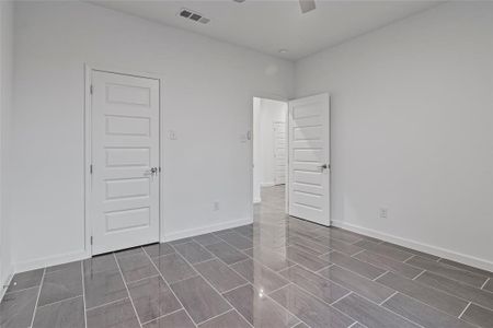 Unfurnished room featuring ceiling fan