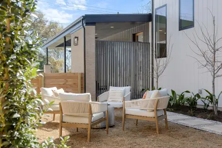 View of patio with an outdoor living space and fence