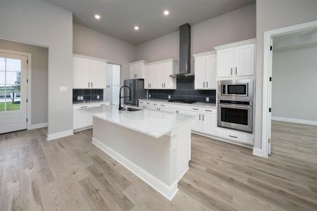 With an open layout, the kitchen island becomes the focal point, offering a spacious and inviting atmosphere that encourages family members to gather, chat, and enjoy each other's company while meals are prepared.