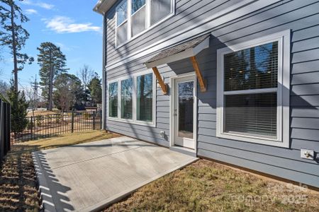 Backyard is fenced with patio