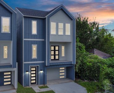 Nestled on a corner lot with an attached garage and outdoor balcony.