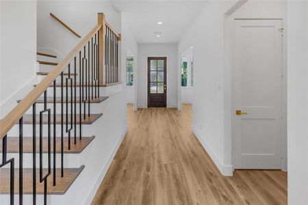 Foyer entrance featuring light hardwood / wood-style floors