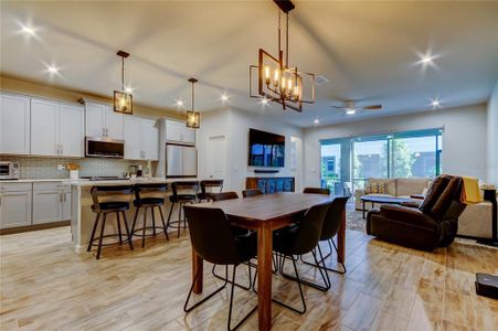 Designer kitchen with abundant cabinet space and a center island with a breakfast bar