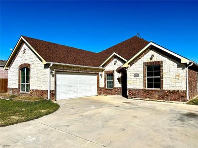 View of front of property with a garage