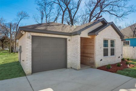 Ranch-style home featuring a front yard