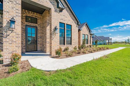 Entrance to property featuring a lawn