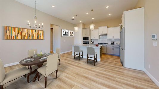 Experience Culinary excellence in the kitchen at Winfrey Estates, where state-of-the-art appliances meet sophisticatd design. This gormet space boasts expansive countertops, stylish cabinetry, and top-of-the-line fixtures, creating an ideal environment for both casual meals and lavish entertaining. *Image is virtually staged and depicts similar floorplan in the community.