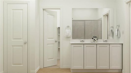 Bathroom featuring vanity and walk in shower