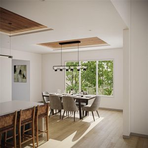 Dining space featuring light wood-type flooring, a tray ceiling, and a notable chandelier