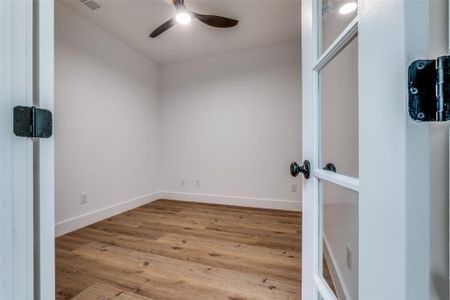Spare room featuring a ceiling fan, visible vents, wood finished floors, and baseboards Spare room featuring a ceiling fan, visible vents, wood finished floors, and baseboards