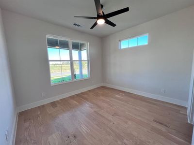 Guest bedroom or office with seperate bathroom. Natural light, wood floors and ceiling fan