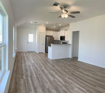 The kitchen overlooks the living room and dining area so that you never miss a beat as you prep your next meal.