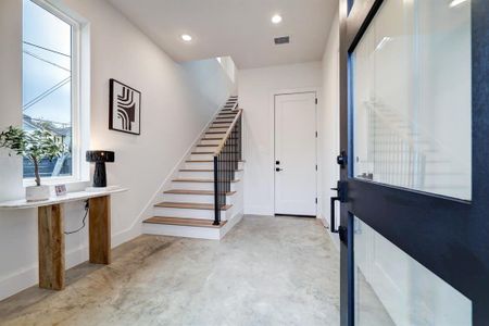 Photos are of 1502 A Ennis, the staged model at Linear on Bell. Choose from two design packages and floor plans. Sleek modern polished concrete flooring on the first level.