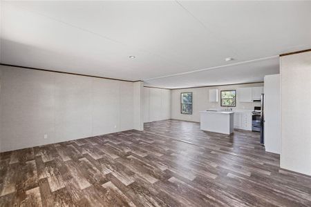 Basement featuring sink and dark hardwood / wood-style floors