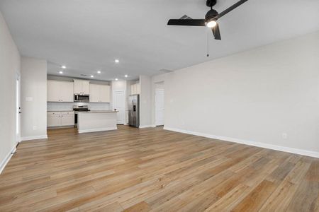 The spacious living room, open to the kitchen.