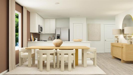 Kitchen with light wood-style flooring, white cabinetry, baseboards, light countertops, and appliances with stainless steel finishes