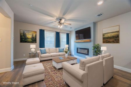 Move in ready living area with celing fan, gas fireplace, window blinds and engineered wood flooring - View