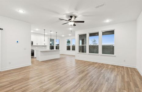 Bright gathering room with large windows *real home pictured